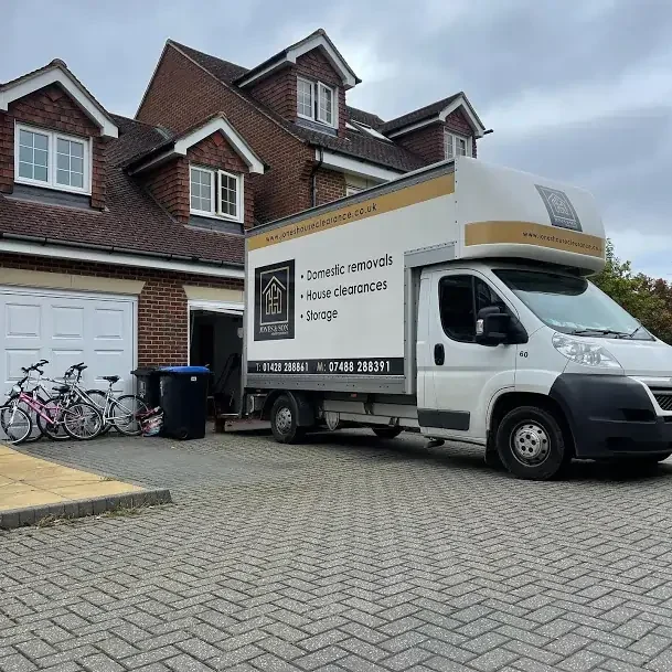Jones & Sons removals truck parked outside a home in Godalming providing professional house removal services.